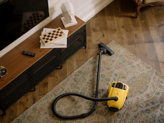 yellow vacuum on a carpet
